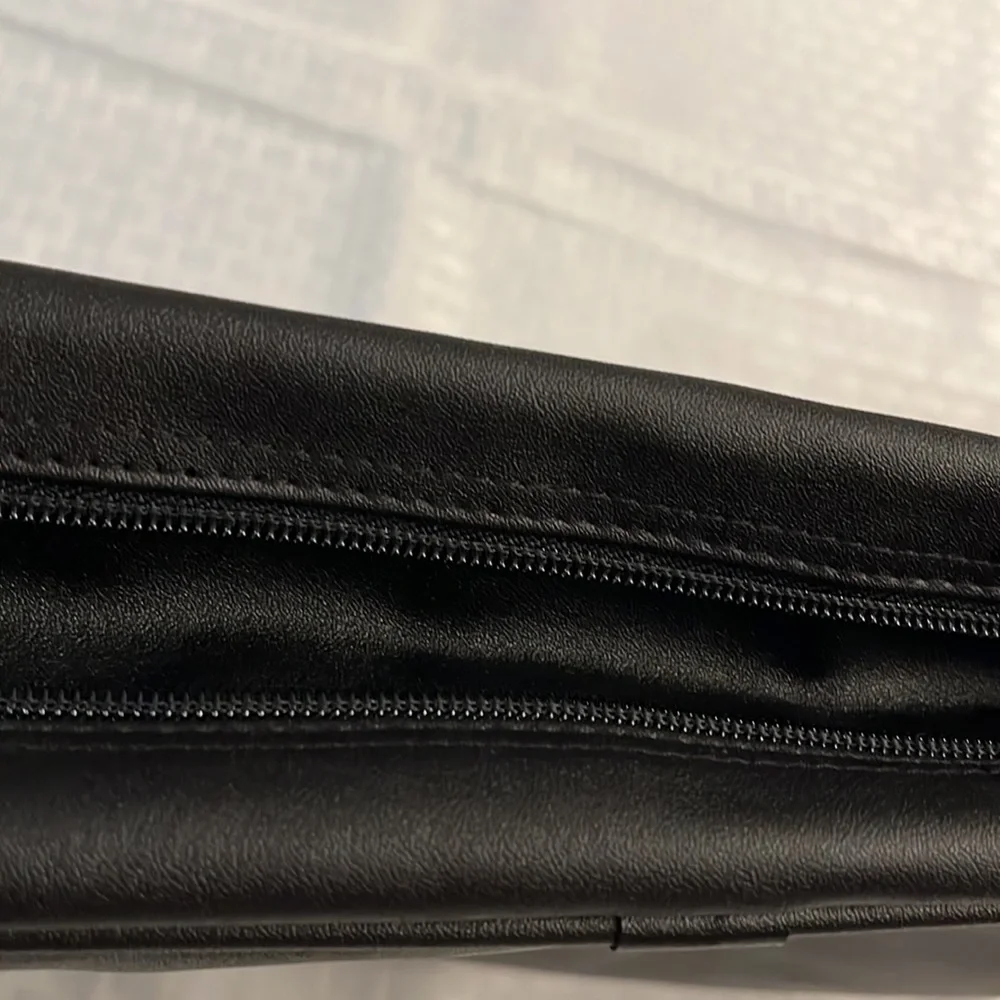 Briefcase, Black, Handles and Shoulder Straps lots of storage.